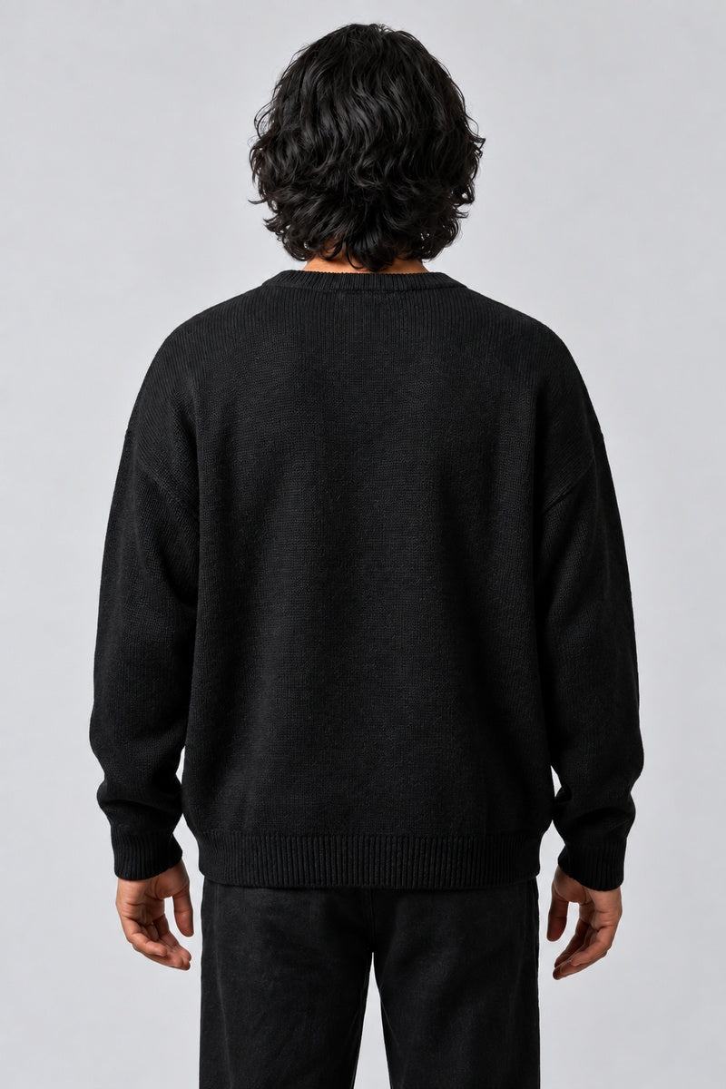 Pull Araignée Jacquard, porté de dos sur fond gris clair