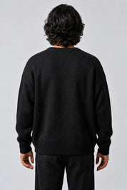 Pull Araignée Jacquard, porté de dos sur fond gris clair