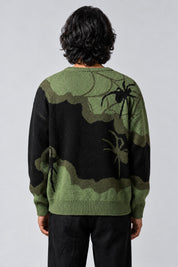 Pull Araignée Patchwork, porté de dos sur fond gris clair