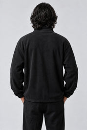 Pull Monaco, porté de dos sur fond gris clair