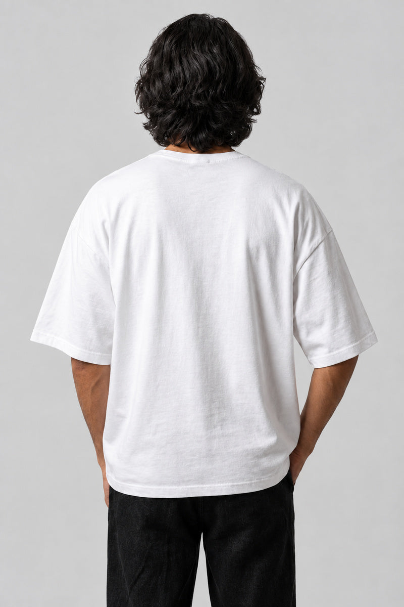 Dos uni du t-shirt Sakura blanc oversize, porté sur fond gris perle.
