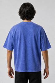 Dos uni du t-shirt bleu délavé Don't Kill My Vibe, porté par un homme.