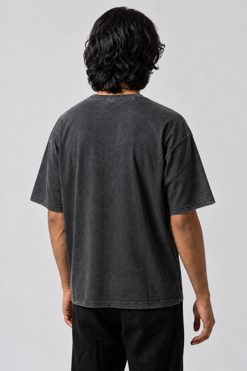 Dos uni du t-shirt Los Angeles noir délavé, porté par un homme.