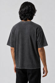 Dos uni du t-shirt Los Angeles noir délavé, porté par un homme.